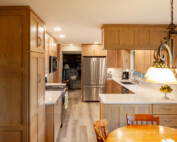 custom kitchen with natural wood finish cabinets